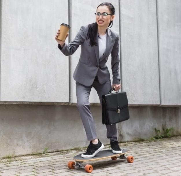 Woman riding skateboard and has overcome social anxiety symptoms